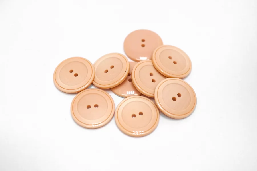 Пуговица костюмно-плательная пластик 22 мм пудровая (P-3) 16112528