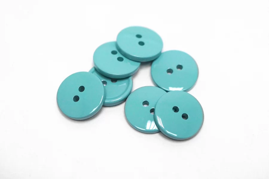 Пуговица костюмно-плательная пластик 15 мм бирюзовая  (О-3)  16112578